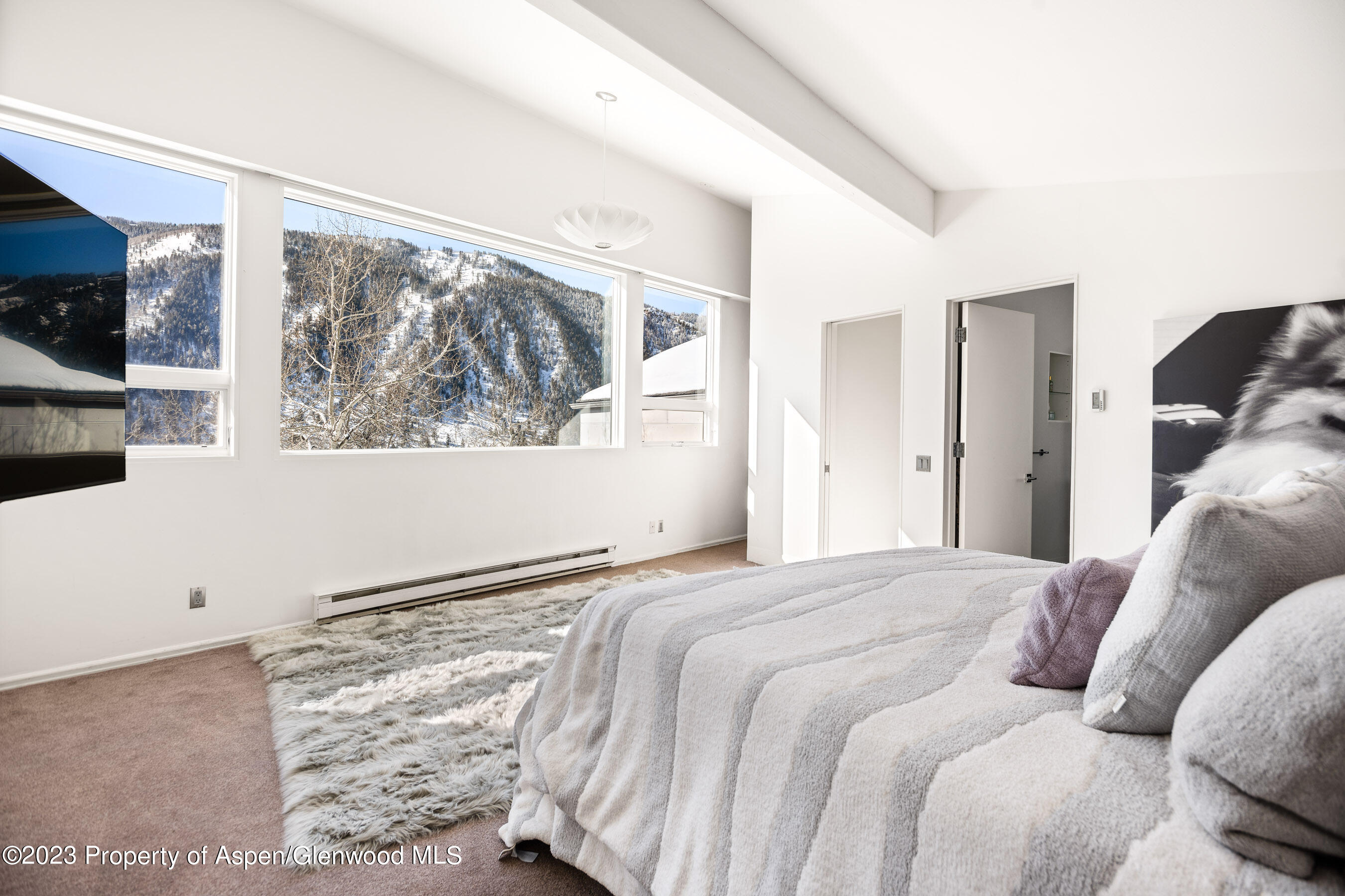 602 Mountain Laurel Drive Aspen, CO 81611 - Photo 10 of 23 a bedroom with a large window with the outer view