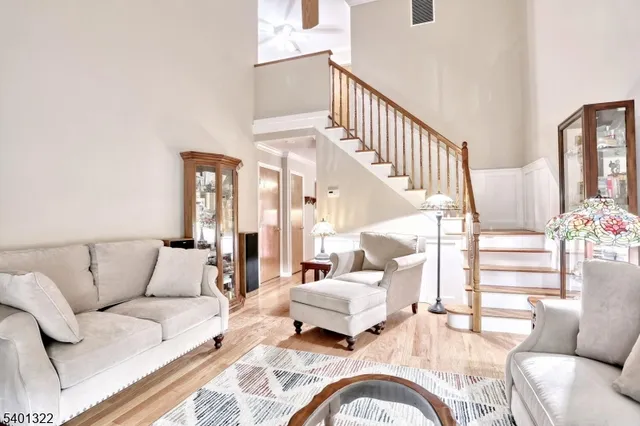 a living room with furniture or couch and a potted plant