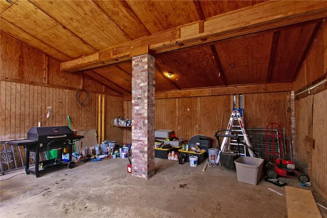 a room with furniture and two windows