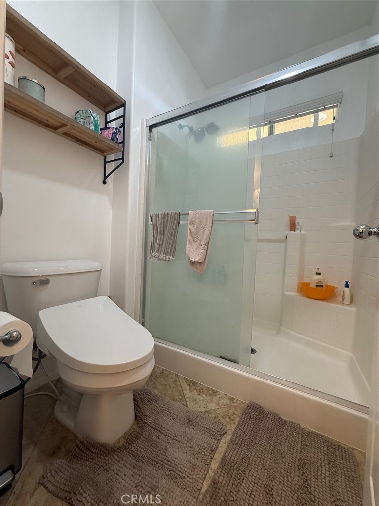 8041 City View Place Rancho Cucamonga, CA 91730 - Photo 11 of 21 a bathroom with a toilet and a shower