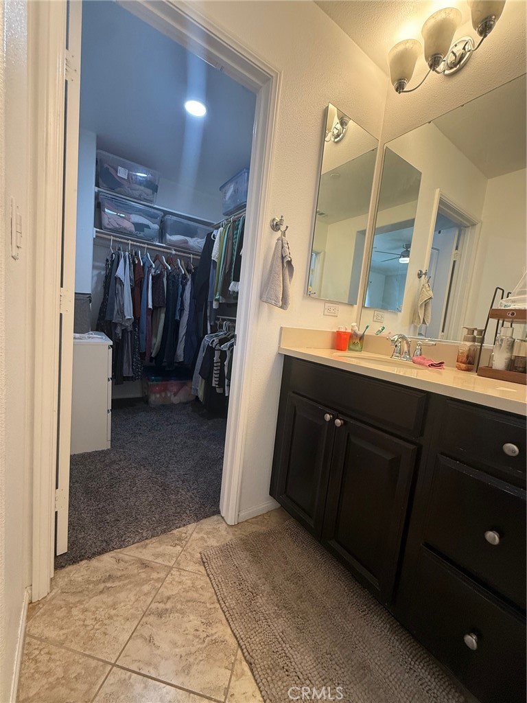 8041 City View Place Rancho Cucamonga, CA 91730 - Photo 12 of 21 a bathroom with a sink a mirror and a shower