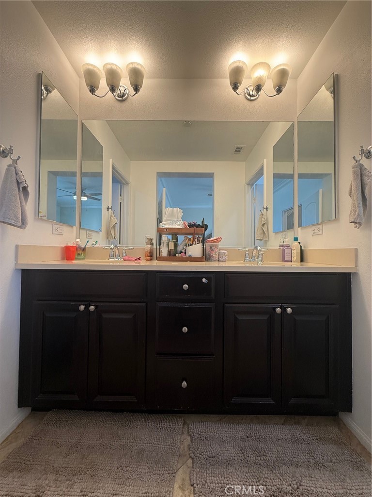 8041 City View Place Rancho Cucamonga, CA 91730 - Photo 13 of 21 a bathroom with a sink double vanity and a mirror