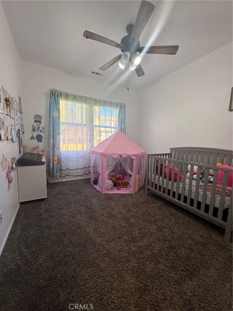 8041 City View Place Rancho Cucamonga, CA 91730 - Photo 15 of 21 a living room with a bed furniture and a window