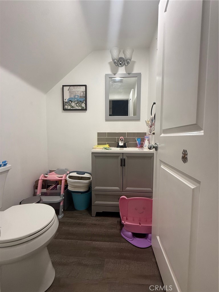 8041 City View Place Rancho Cucamonga, CA 91730 - Photo 7 of 21 a bathroom with a toilet sink and mirror