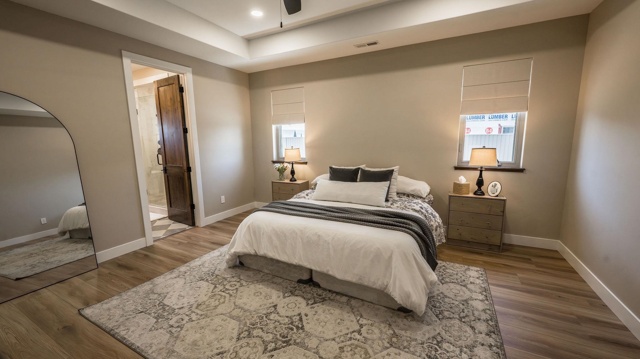 2639 Emerald Ridge Lane Grand Junction, CO 81506 - Photo 13 of 42 a bedroom with a bed and wooden floor