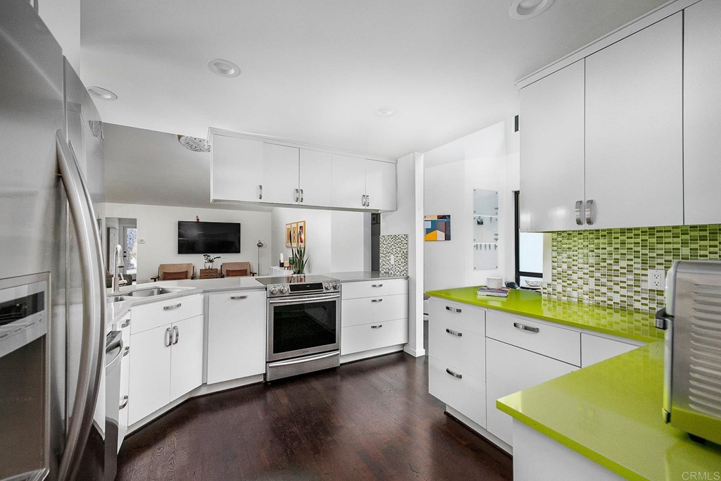 3095 Colley Lane Escondido, CA 92025 - Photo 12 of 51 a kitchen with a sink a stove and refrigerator