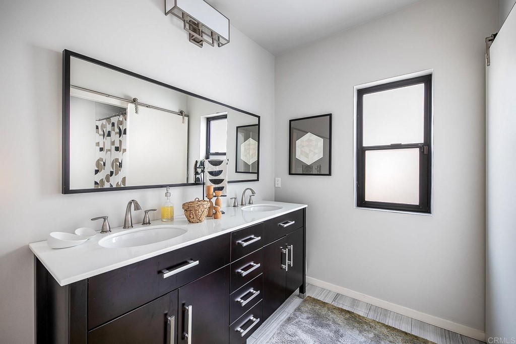 3095 Colley Lane Escondido, CA 92025 - Photo 23 of 51 a bathroom with 2 sink and a mirror
