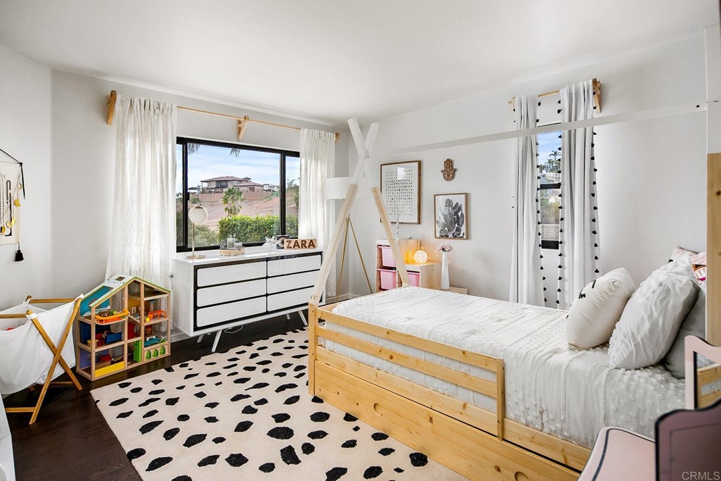 3095 Colley Lane Escondido, CA 92025 - Photo 24 of 51 a bedroom with a bed and wooden floor