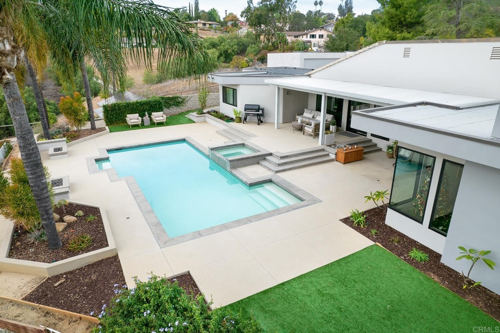 3095 Colley Lane Escondido, CA 92025 - Photo 51 of 51 a view of a patio with table and chairs potted plants and palm tree