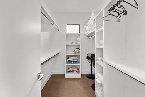 a bedroom with a bed and a table