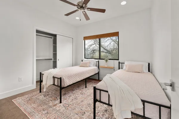 a bedroom with furniture and a window