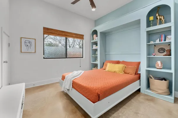 a bathroom with a sink toilet vanity and shower