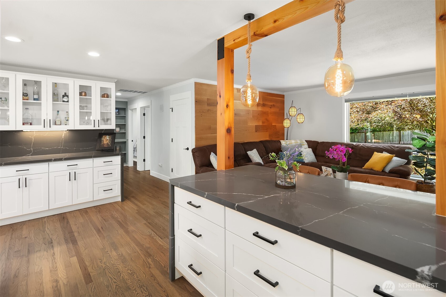 7245 Northeast 170th Street Kenmore, WA 98028 - Photo 11 of 35 a kitchen with stainless steel appliances granite countertop a sink dishwasher and white cabinets with wooden floor