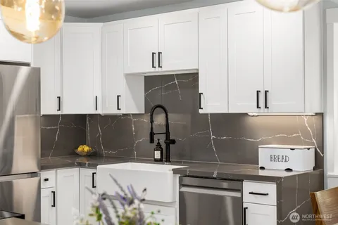 a kitchen with a sink and cabinets