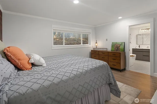 a bedroom with a bed and a dresser