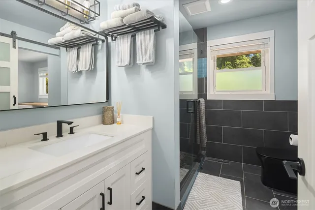a bathroom with a sink and a mirror