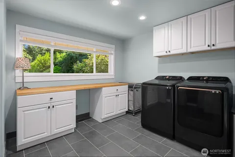 a kitchen with a stove and a white cabinet