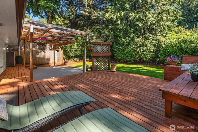 a view of an outdoor sitting area with wooden floor