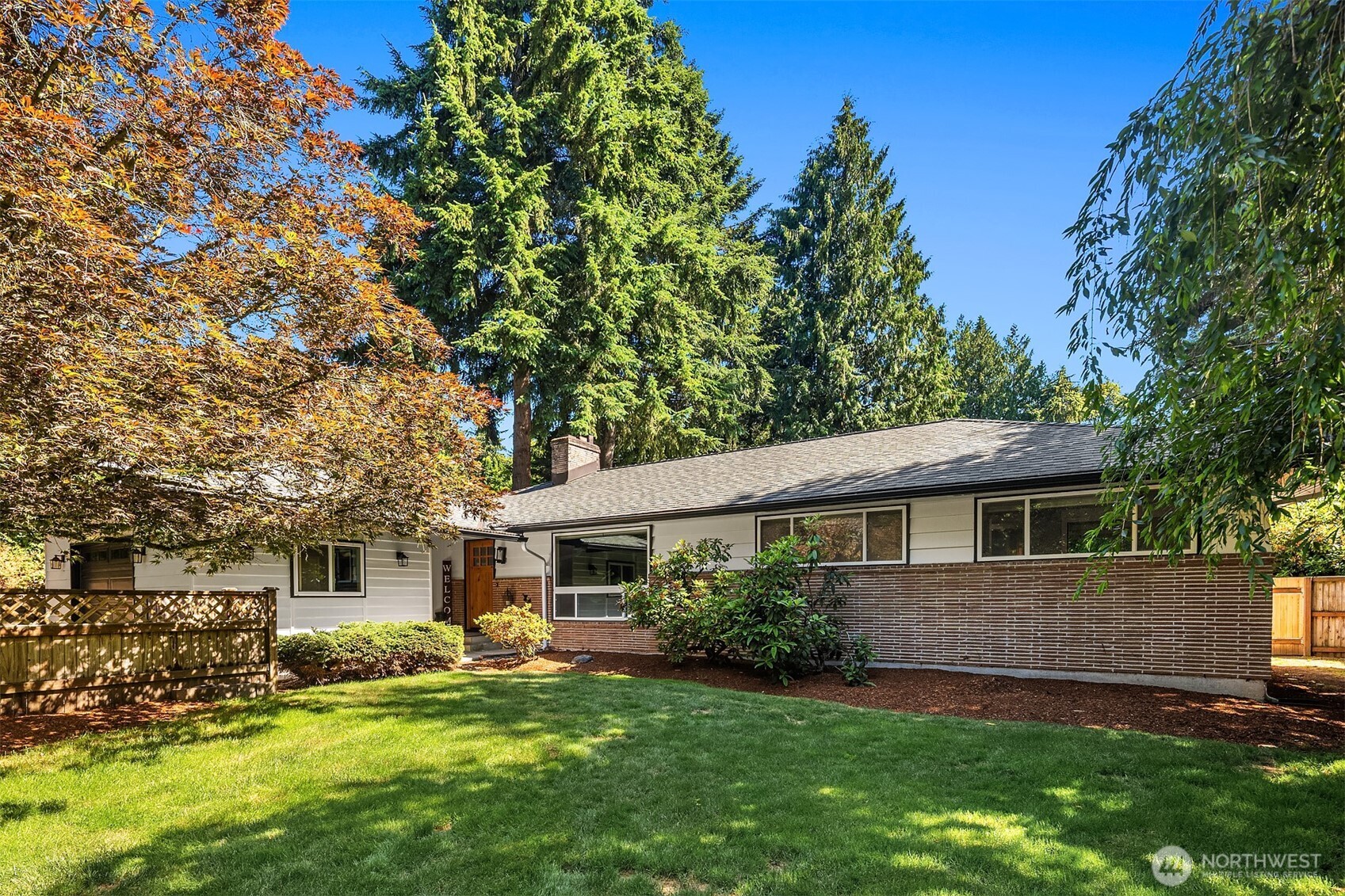 7245 Northeast 170th Street Kenmore, WA 98028 - Photo 35 of 35 a front view of a house with a yard