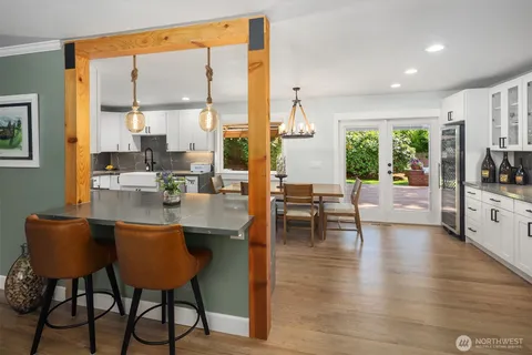 a living room with fireplace furniture and a large window