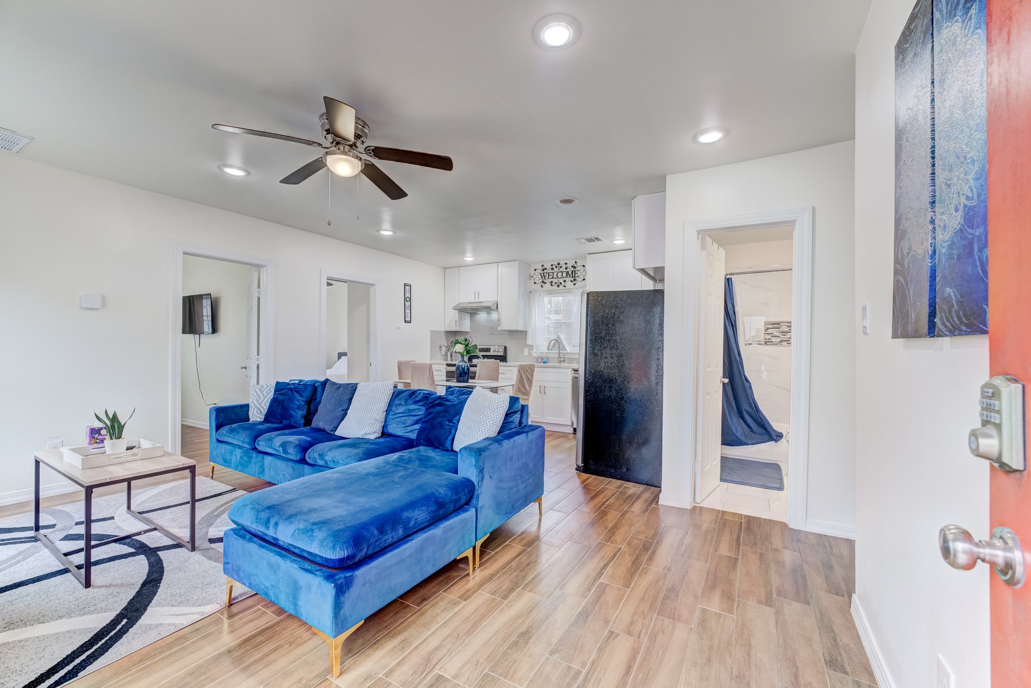 2720 Truxillo Street, Unit 5 Houston, TX 77004 - Photo 2 of 30 a living room with furniture and a wooden floor