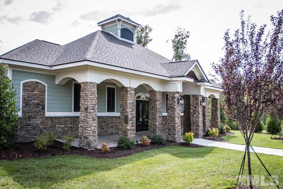 3438 Grosbeak Way Raleigh, NC 27616 - Photo 16 of 19 a front view of a house with a yard