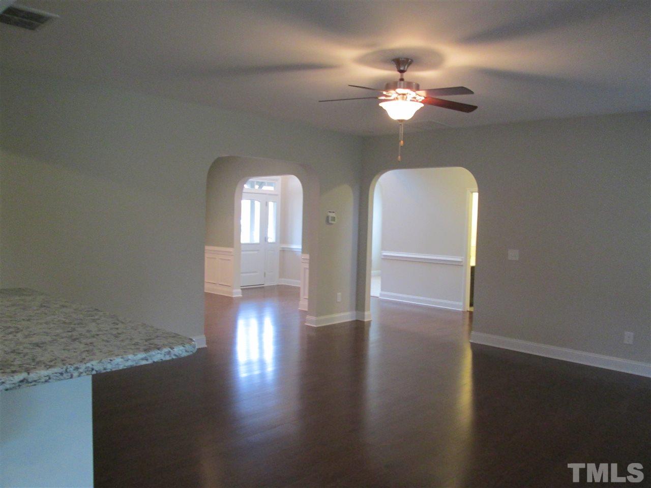 3438 Grosbeak Way Raleigh, NC 27616 - Photo 3 of 19 a view of livingroom with hardwood floor and ceiling fan