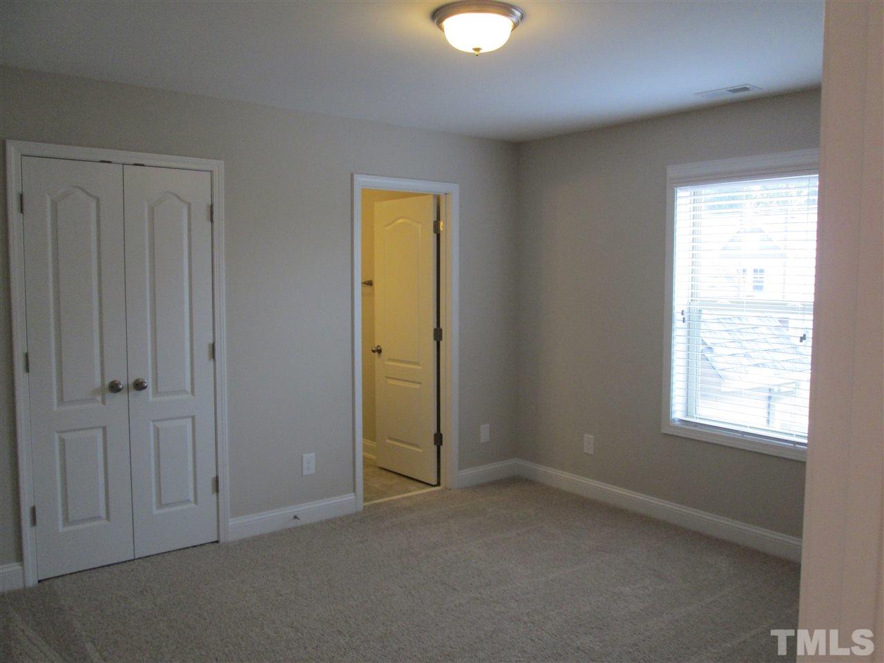 3438 Grosbeak Way Raleigh, NC 27616 - Photo 10 of 19 an empty room with windows