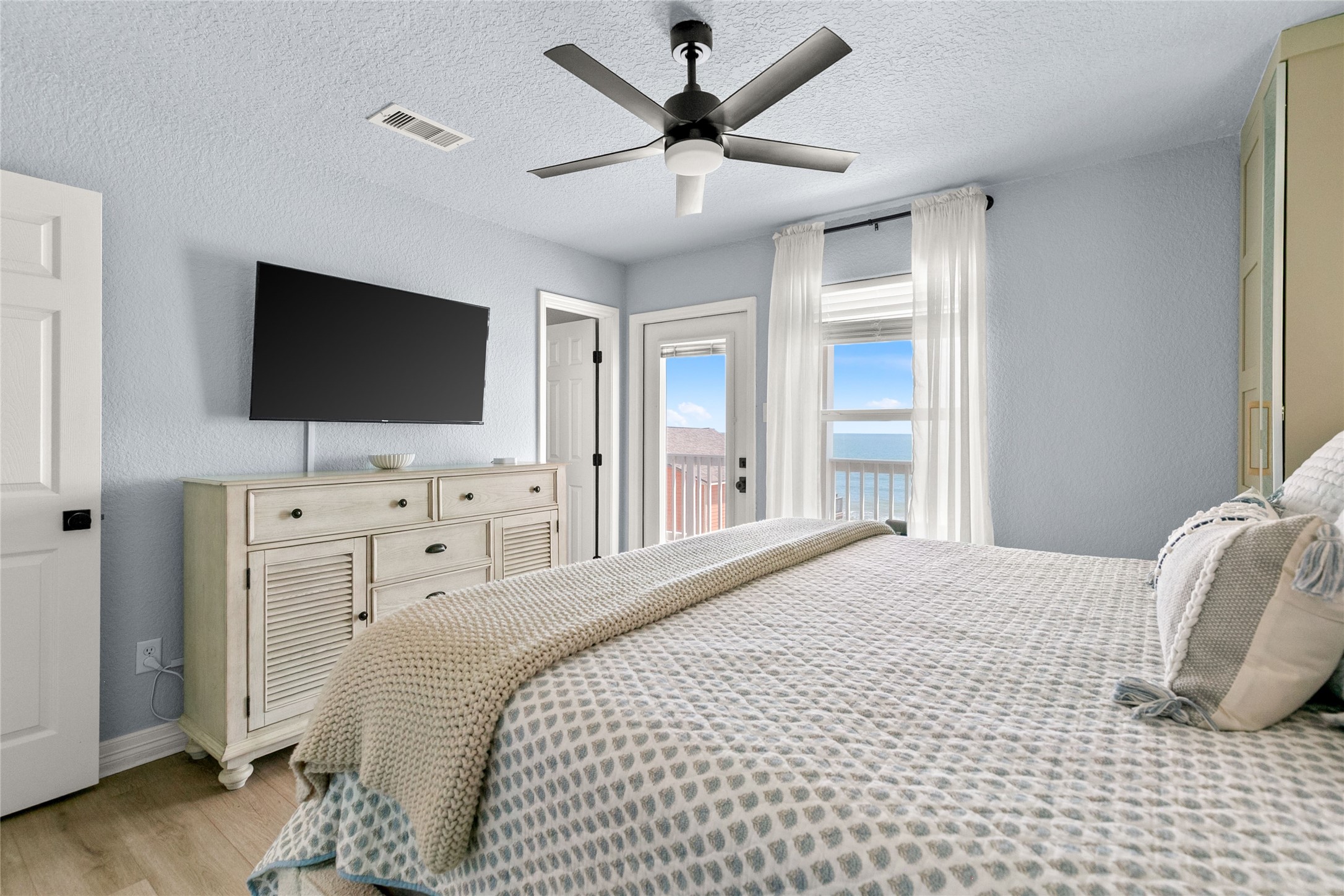 1213 Sargasso Circle Surfside Beach, TX 77541 - Photo 15 of 40 a bedroom with a bed and a flat screen tv
