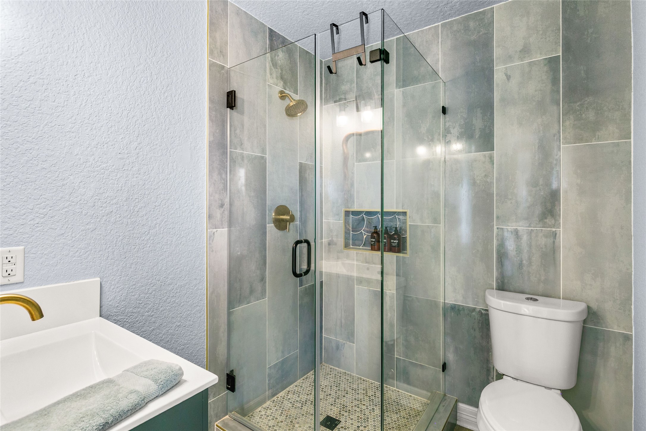 1213 Sargasso Circle Surfside Beach, TX 77541 - Photo 16 of 40 a bathroom with a shower a toilet and a sink