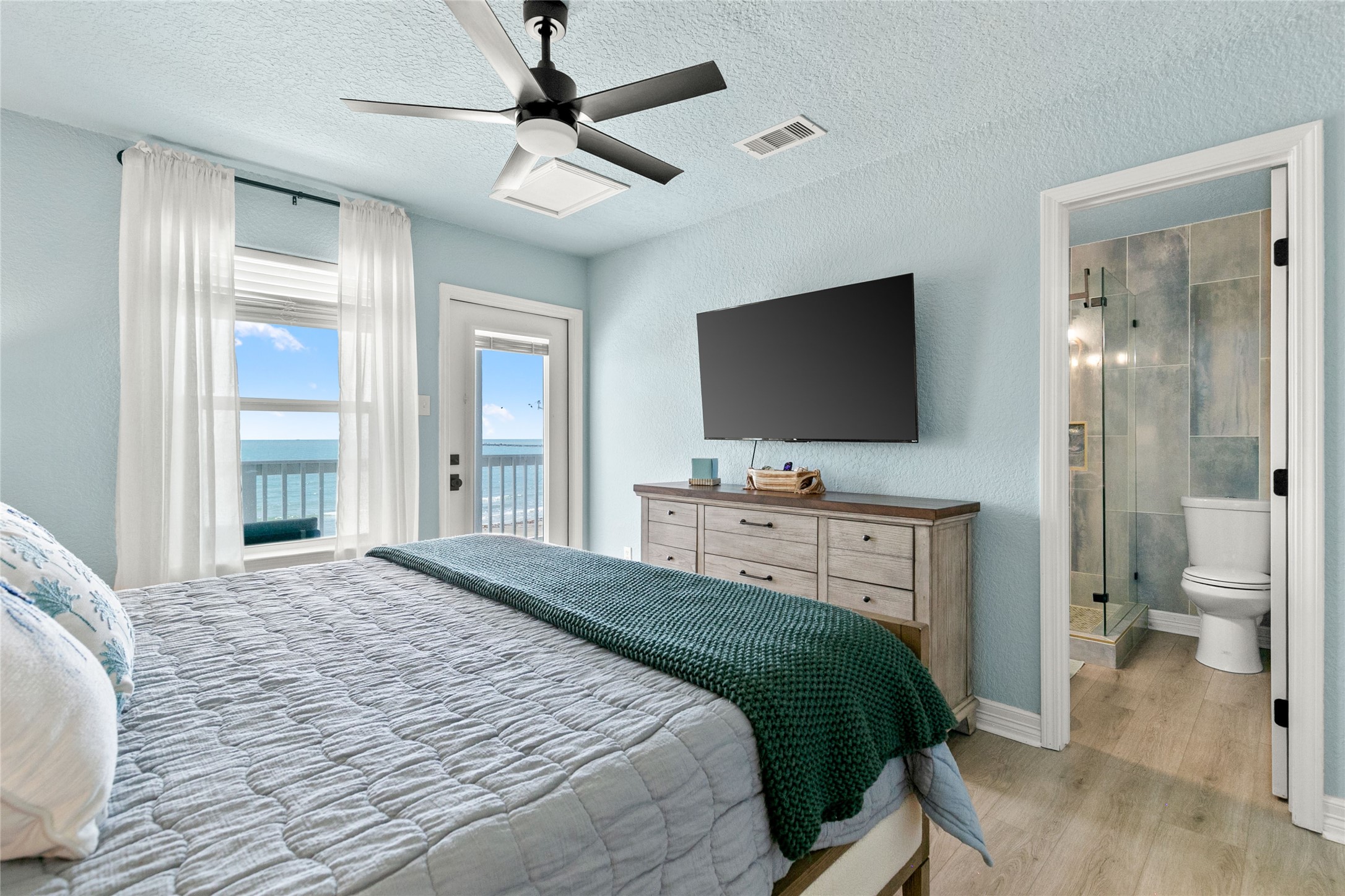 1213 Sargasso Circle Surfside Beach, TX 77541 - Photo 22 of 40 a bedroom with a bed and a flat screen tv