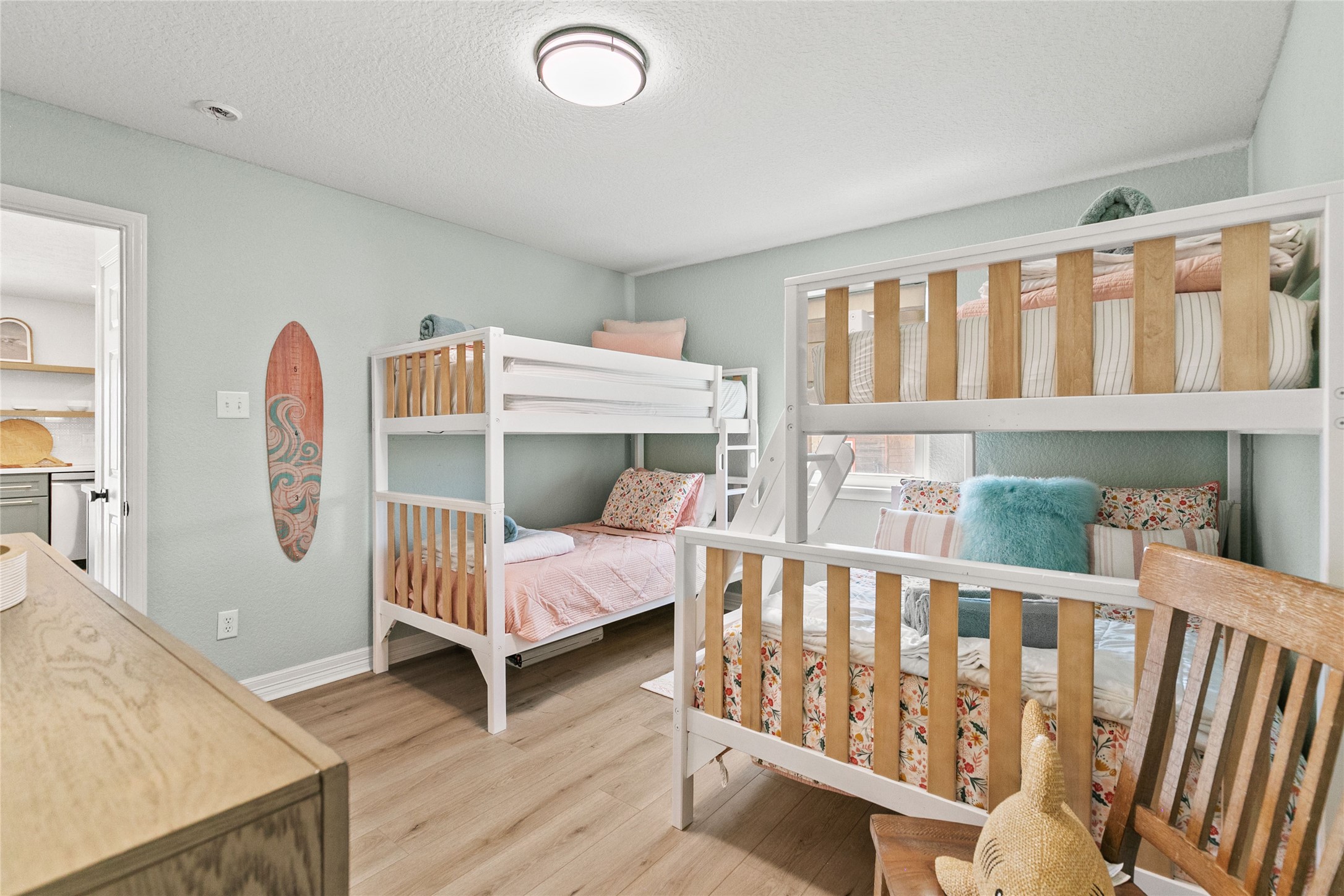 1213 Sargasso Circle Surfside Beach, TX 77541 - Photo 28 of 40 a view of a room with furniture and wooden floor
