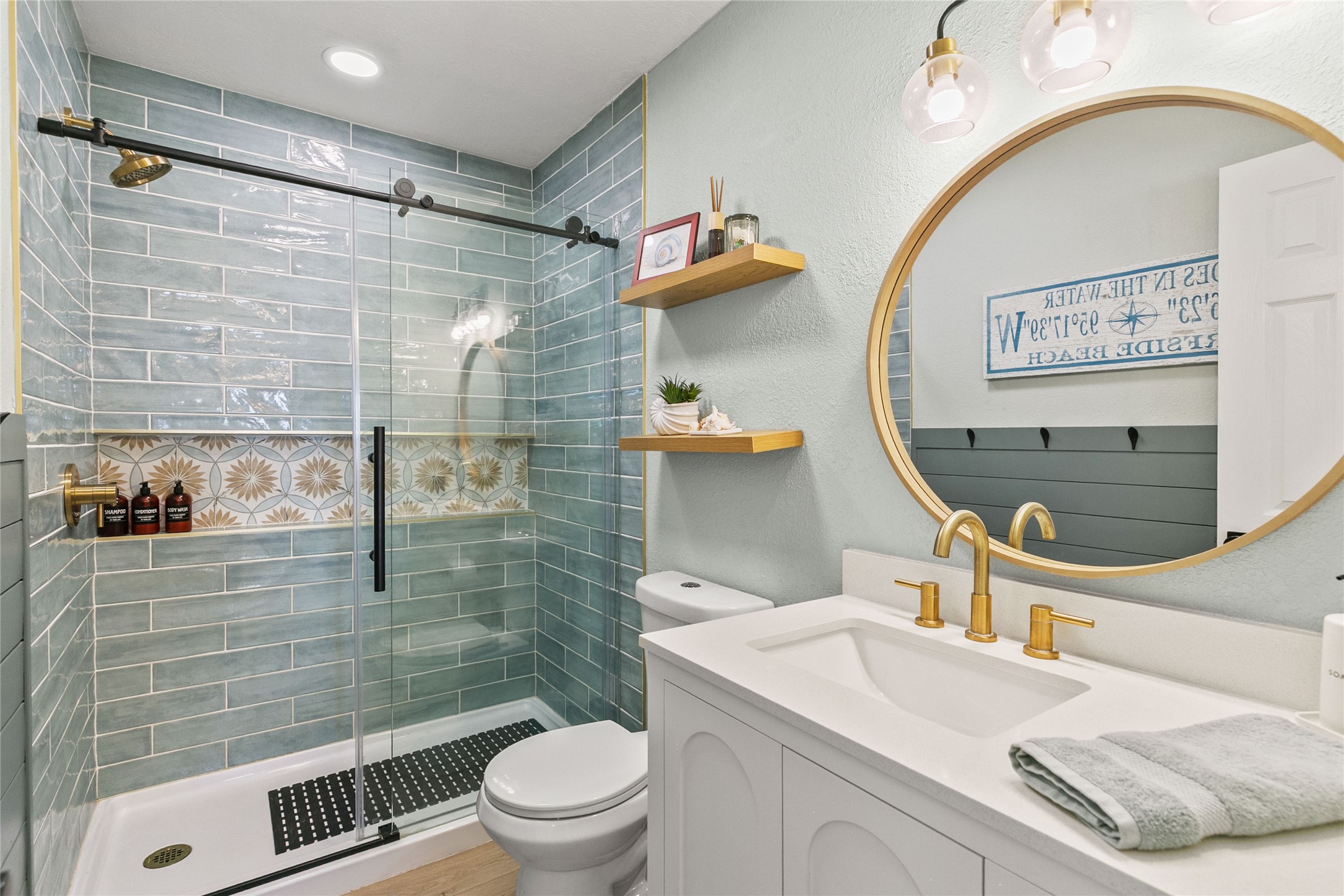 1213 Sargasso Circle Surfside Beach, TX 77541 - Photo 29 of 40 a bathroom with a sink a toilet and shower