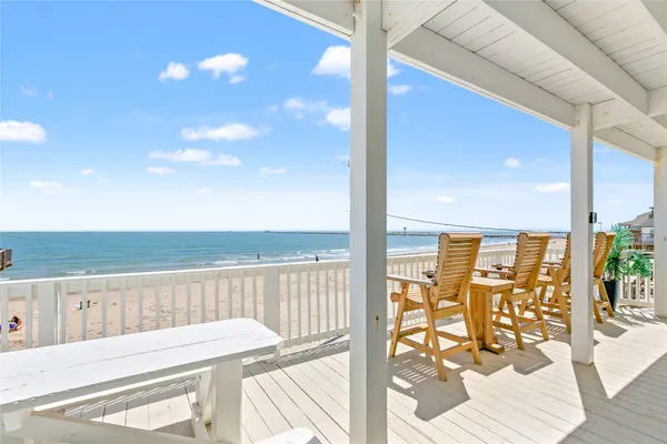 a view of balcony with wooden floor