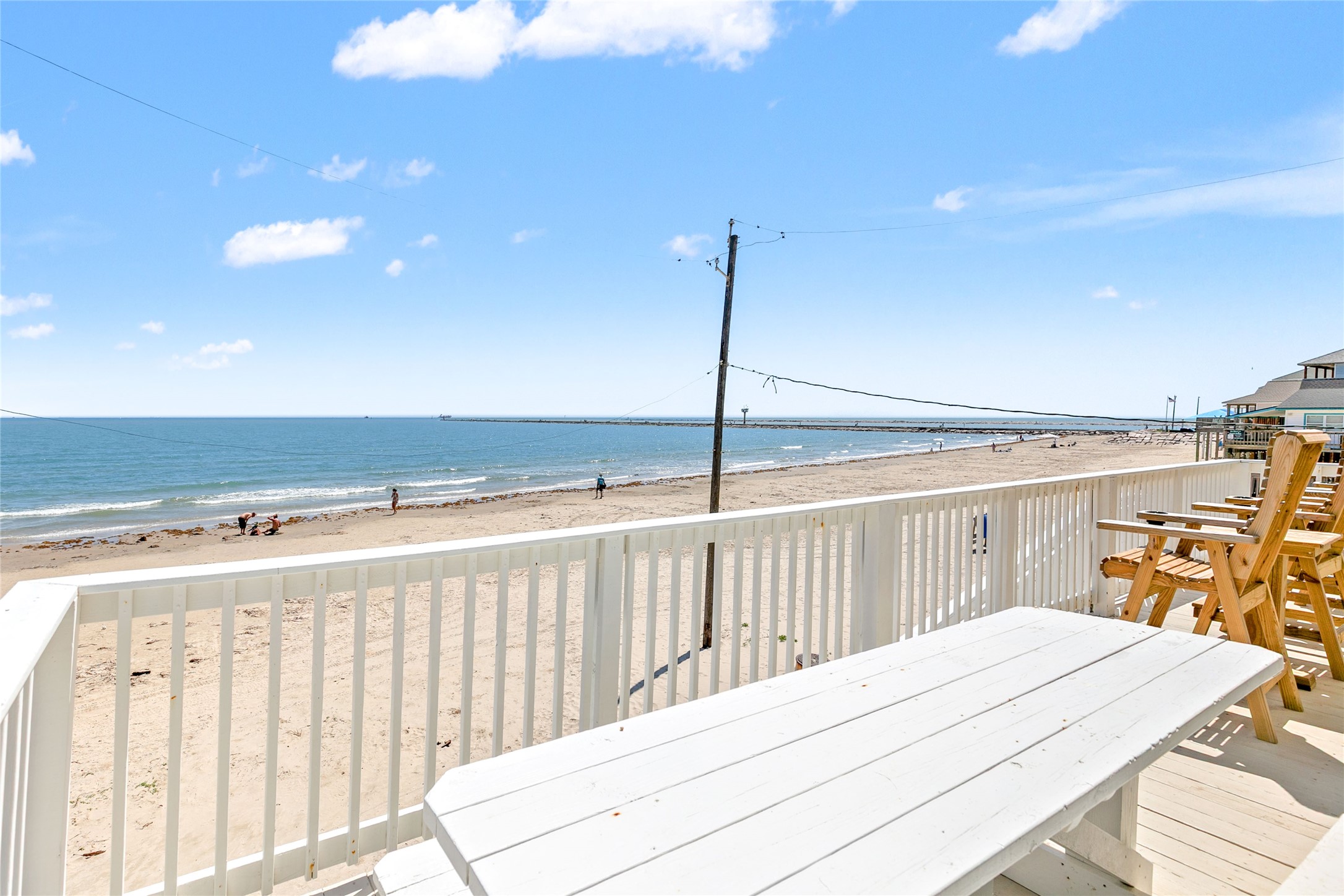 1213 Sargasso Circle Surfside Beach, TX 77541 - Photo 32 of 40 a bedroom with a bed and a chandelier