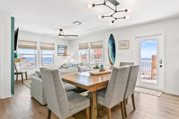 a view of a dining room with furniture window and wooden floor
