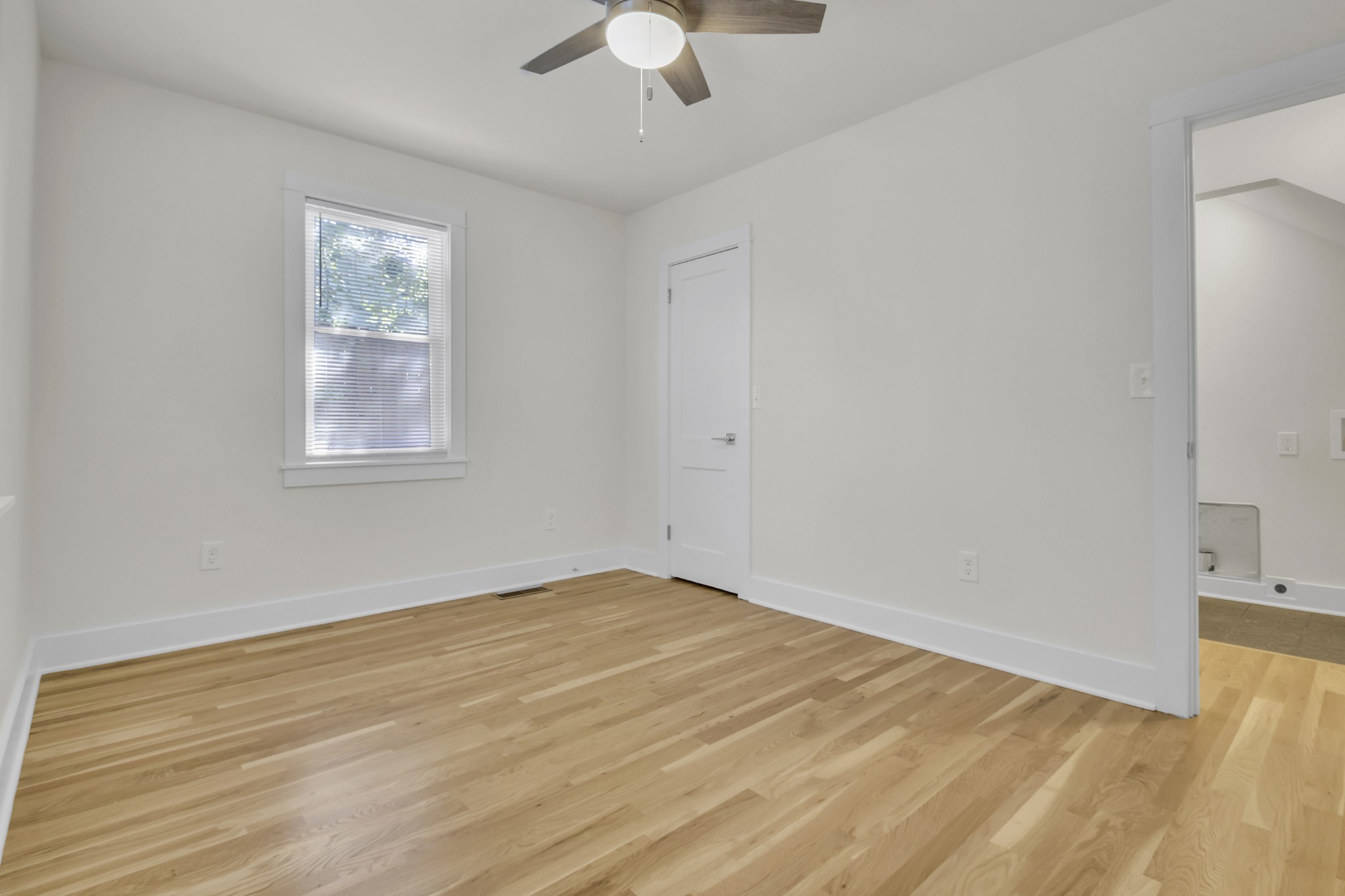 1121 Goldilocks Street Madison, TN 37115 - Photo 18 of 31 wooden floor in an empty room with a window