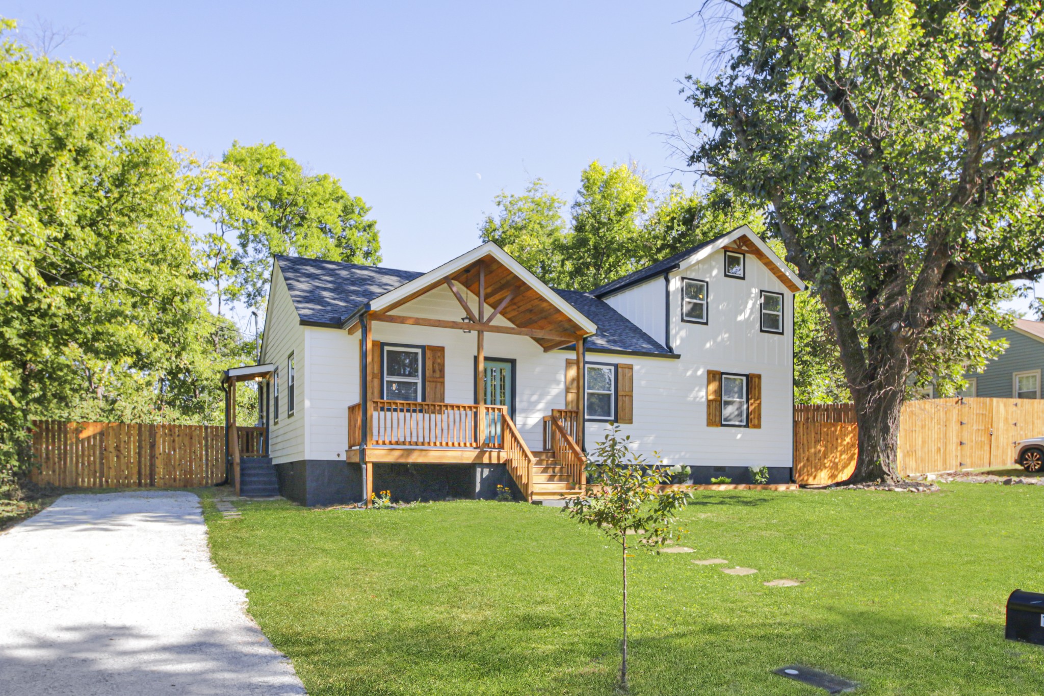 1121 Goldilocks Street Madison, TN 37115 - Photo 2 of 31 a view of a backyard with plants and large tree