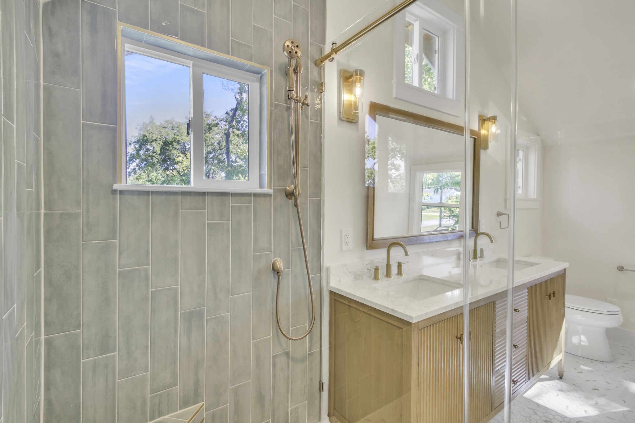 1121 Goldilocks Street Madison, TN 37115 - Photo 29 of 31 a bathroom with a granite countertop sink a toilet and a shower