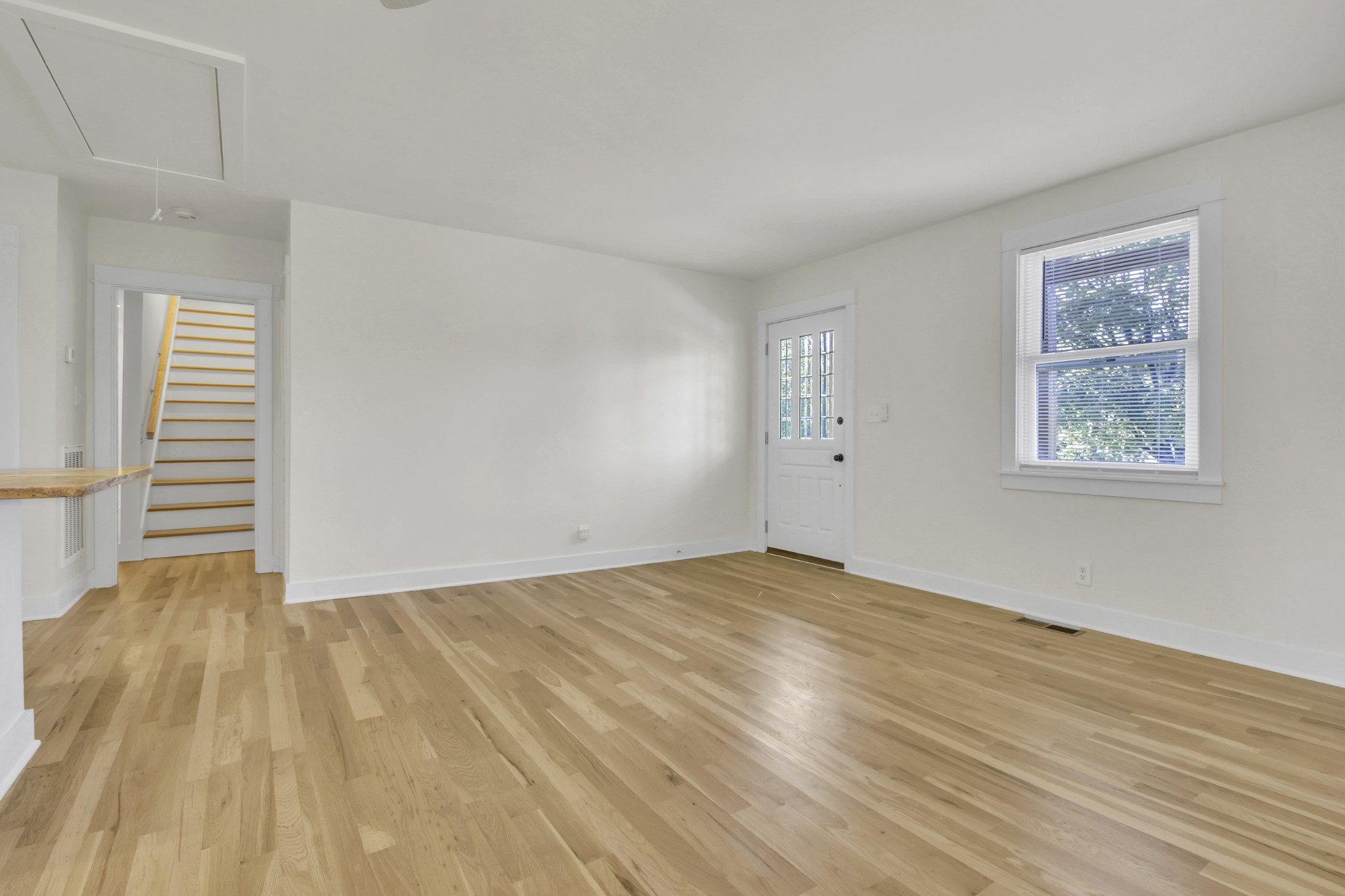 1121 Goldilocks Street Madison, TN 37115 - Photo 9 of 31 a view of an empty room with wooden floor and a window