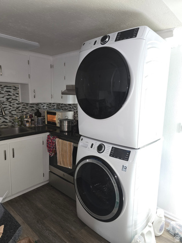 1273 North 400 East, Unit 4 Logan, UT 84341 - Photo 5 of 12 Compact laundry area featuring a stacked washer and dryer unit