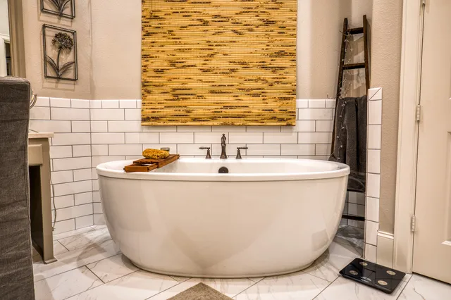 a white bath tub sitting in a bathroom