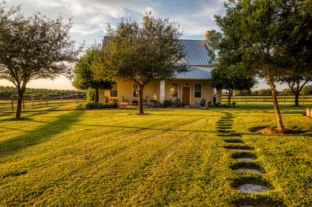 a swimming pool with trees in front of it