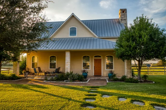 a front view of house with yard and green space