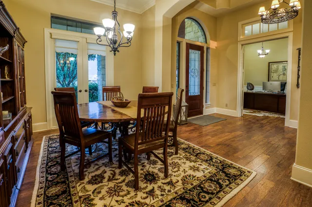 a view of a dining room with furniture and wooden floor