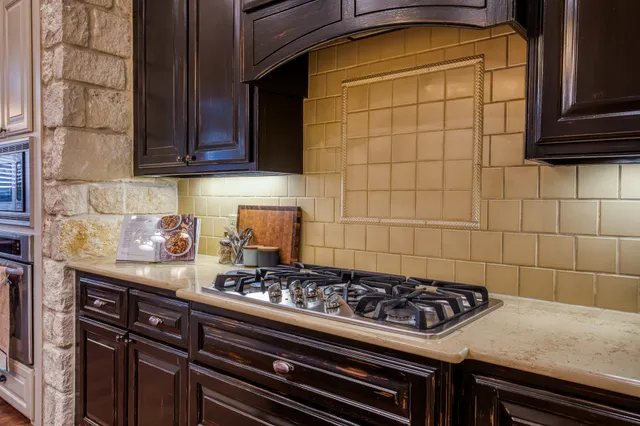 a kitchen with a stove and a cabinet