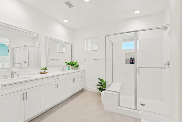 a view of a house with backyard porch and sitting area