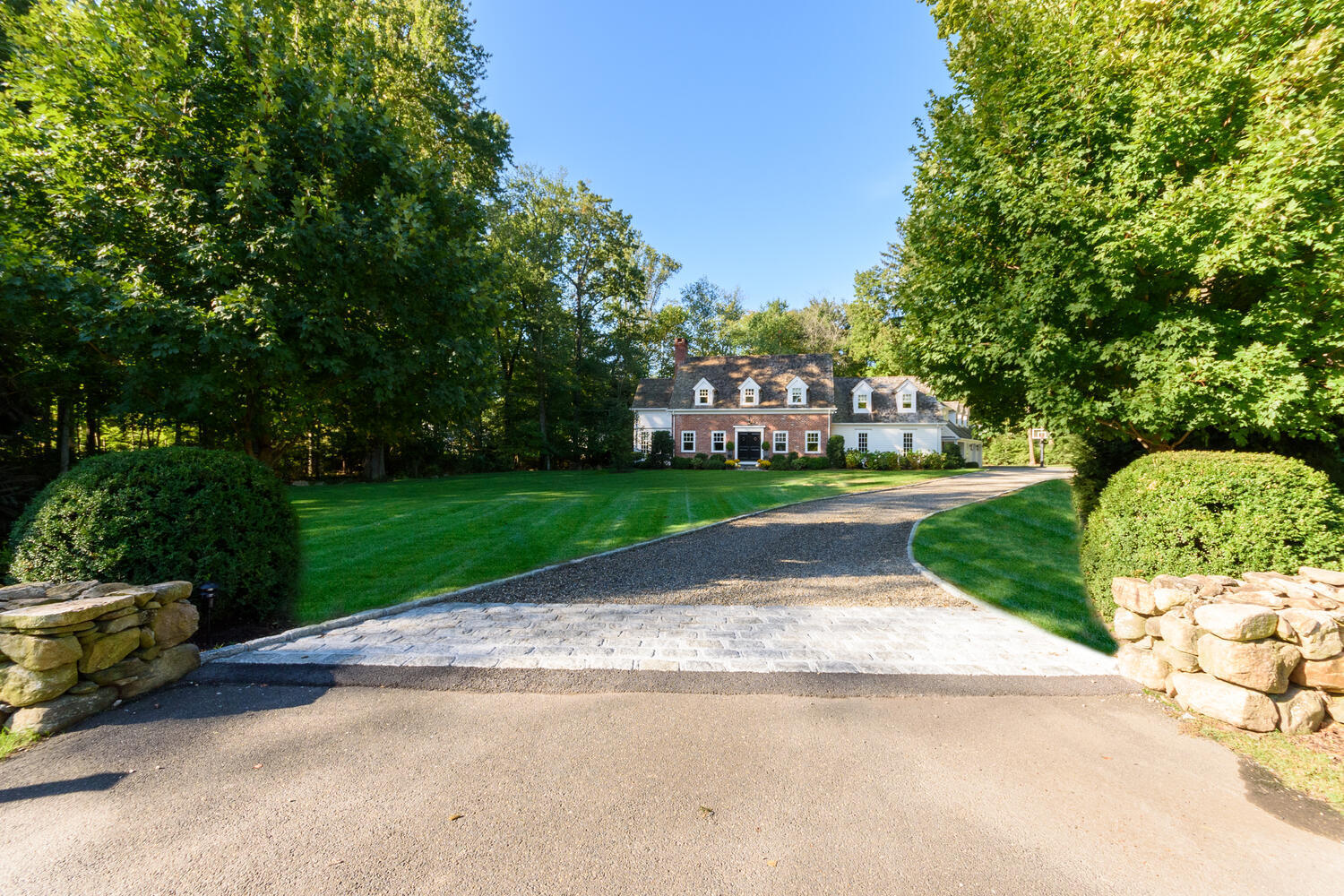 293 Hollow Tree Ridge Road Darien, CT 06820 - Photo 1 of 46 a view of a park with plants and a bench