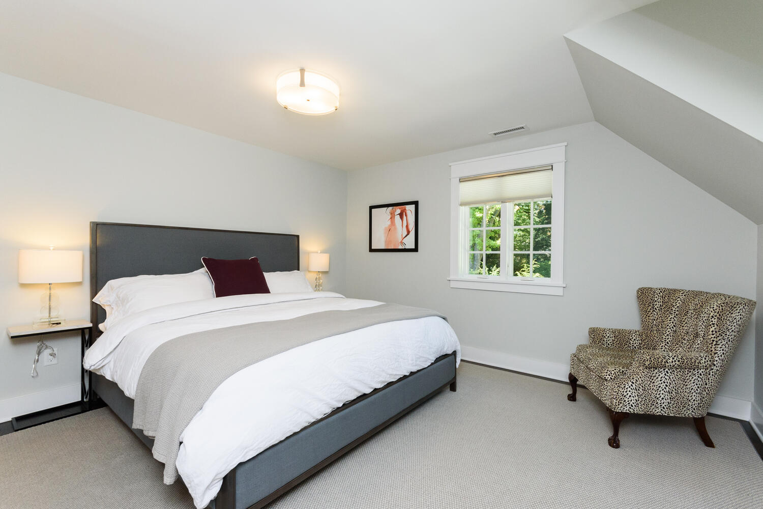 293 Hollow Tree Ridge Road Darien, CT 06820 - Photo 26 of 46 a bedroom with a bed and a couch