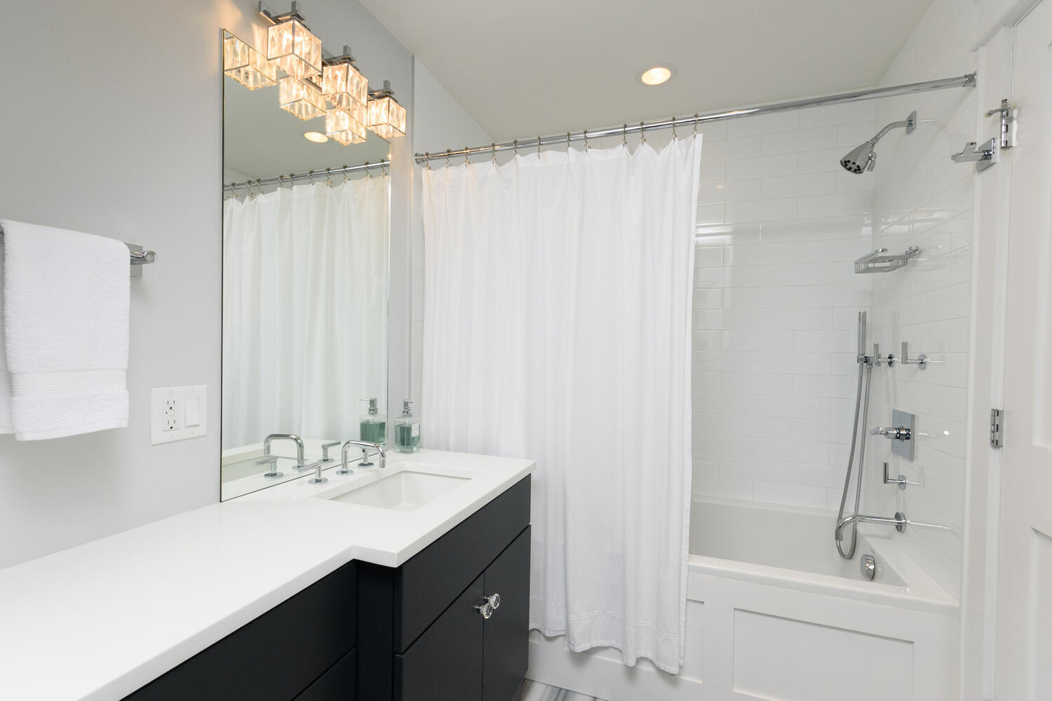 293 Hollow Tree Ridge Road Darien, CT 06820 - Photo 27 of 46 a bathroom with a double vanity sink mirror and shower